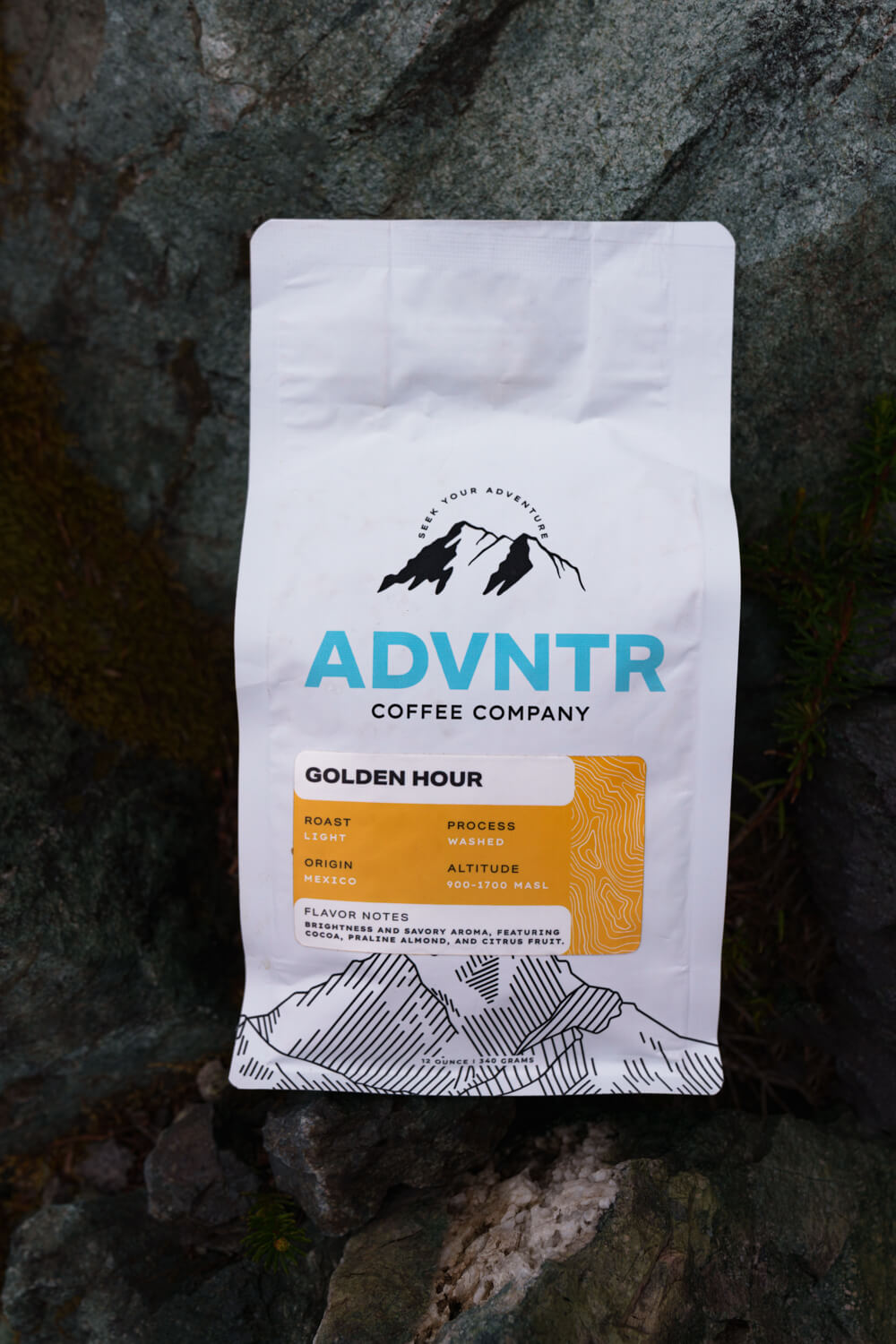 advntr coffee golden hour bag sitting on dark rocks